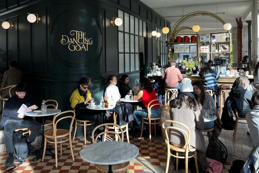 This is an image of the interior of a cosy cafe with lots of indoor seating.