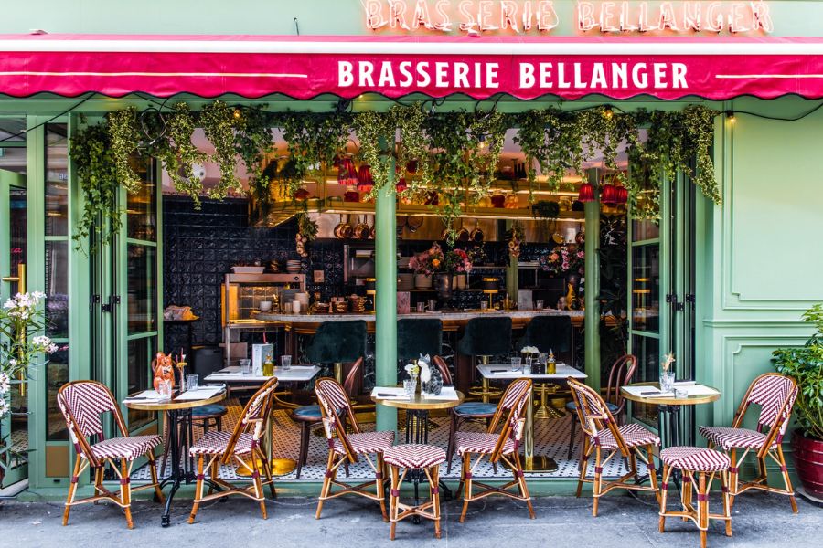 This is an image of a café with seating out the front and a big bar.