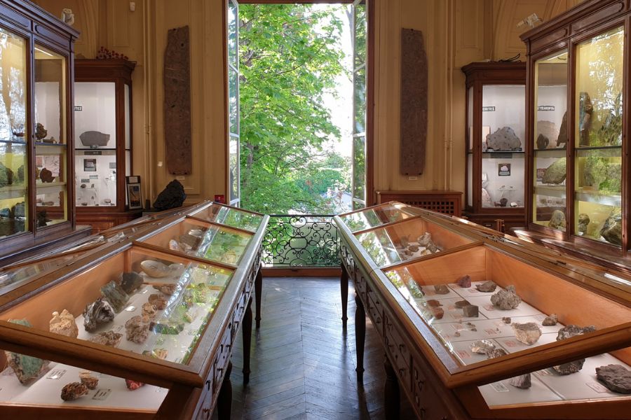 This is an image of a museum room full of cases with minerals and rocks.