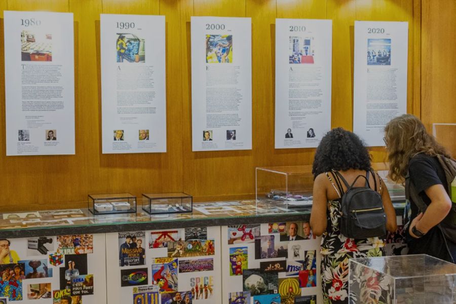 This is an image of two girls looking at fakes in Paris' counterfeit museum.