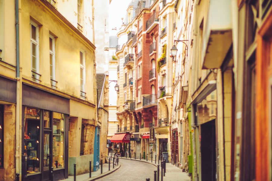 This is an image of a small windy street in the Latin Quarter of Paris.