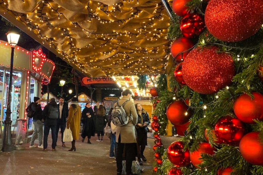 This is an image of a Christmas market with lots of lights and little market stalls.