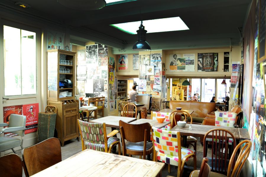 This is an image of a restaurant with cozy mis-matched furniture.