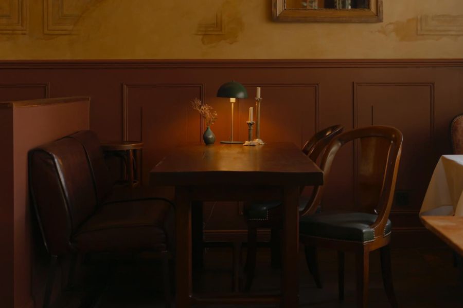 This is an image of a wooden table with low mood lighting.