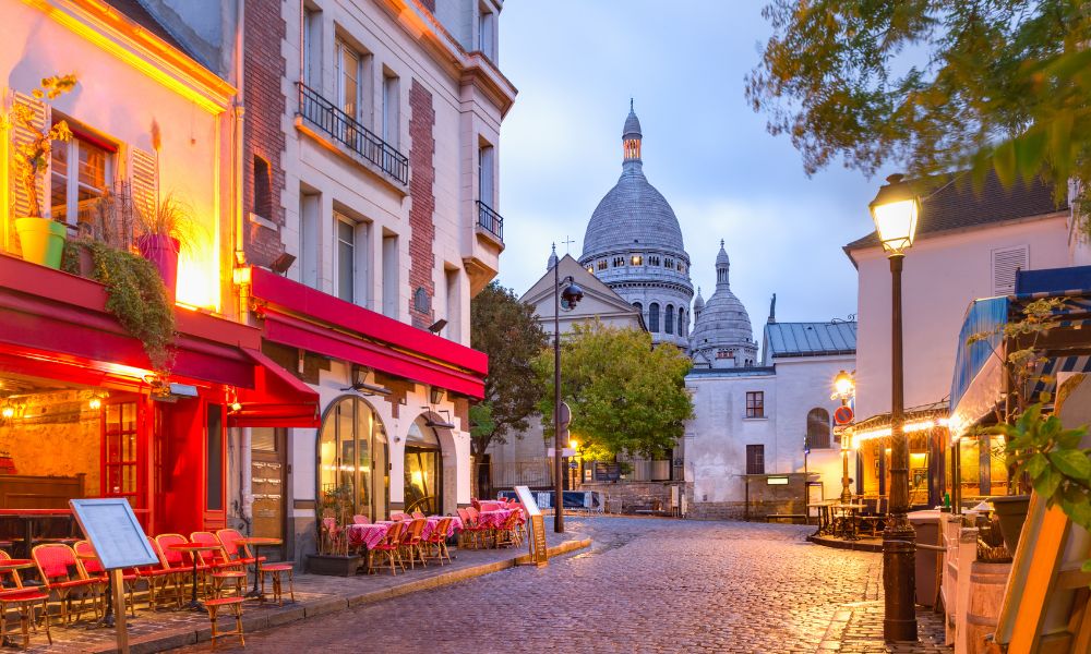 This is an image of a street in Montmartre with a view of the Sacre-Coeur.