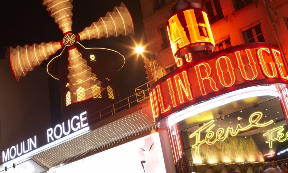 This is an image of the front of Moulin Rouge at night.
