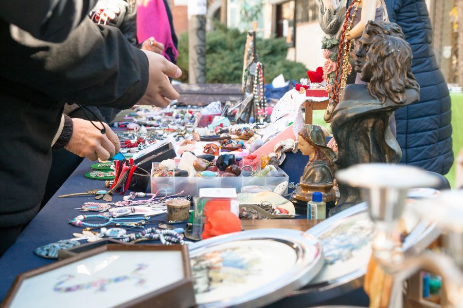This is an image of a collection of knick knacks and antiques on the table.