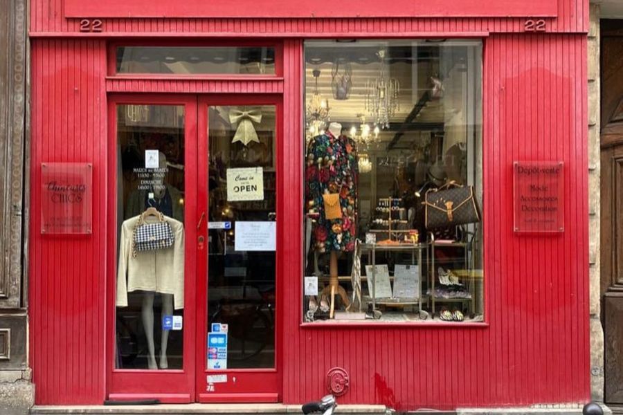 This is a picture of a shopfront. In the window you can see various vintage wares.
