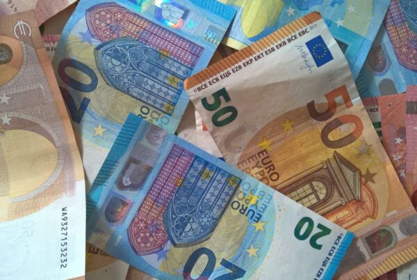 This is an image of a bunch of euros laid out on top of a table.