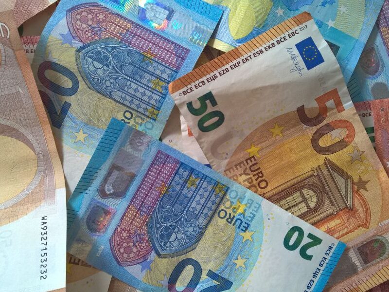 This is an image of a bunch of euros laid out on top of a table.