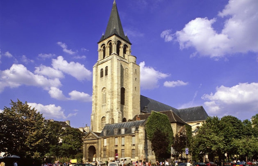 This is an image of Parisian buildings and landmarks with a bright blue sky in the background.