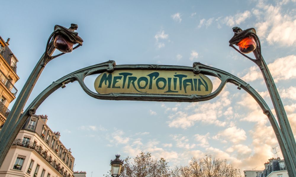 Paris hotel advice: This is an image of the artistic Metropolitan sign outside of the metro stations in Paris