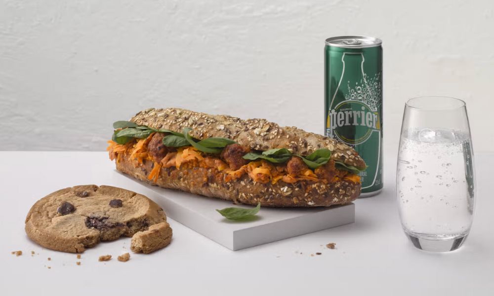 This is an image of a cookie, baguette and soda water, all of which is sold at the little cafe in the train.