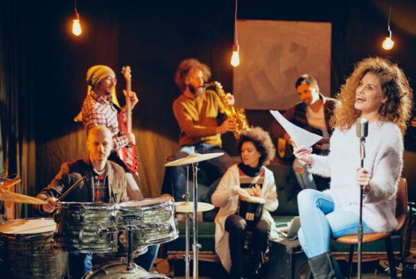 This is an image of a jazz band on stage singing and playing instruments.