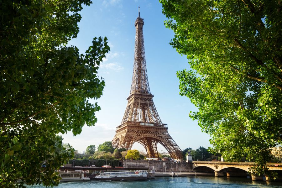 This is an image of the Eiffel Tower among a blue sky.