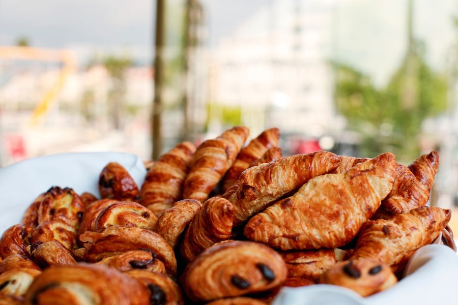 This is an image of a shelf full of different pastries.