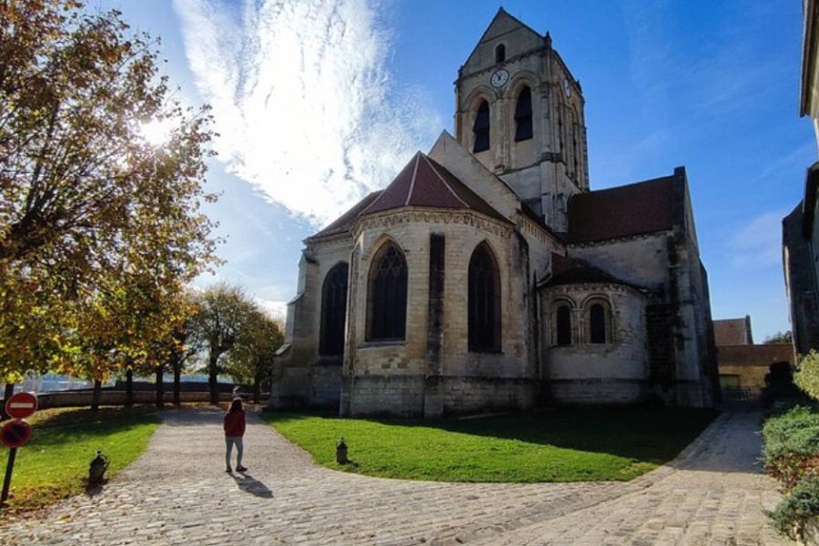 This is an image of a lovely cathedral in a quaint town. It is a sunny day.