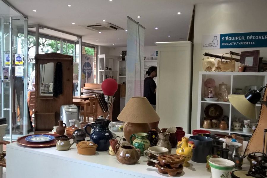 This is an image with lots of fun vintage furniture and household items on a table.