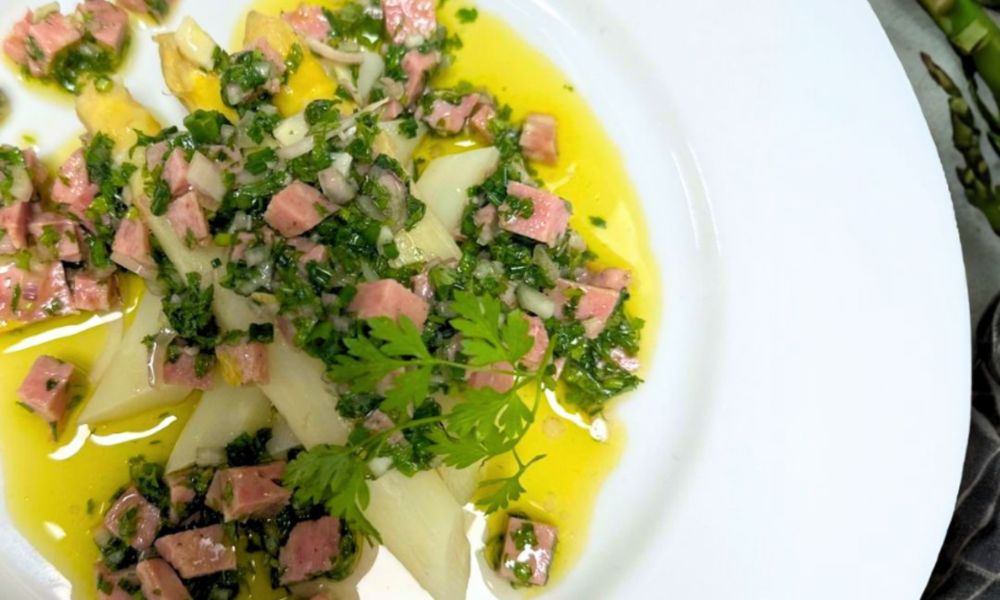 This is an image of duck offs cuts in a nice salad with oil and herbs.