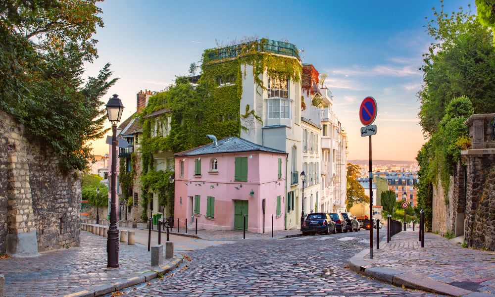 This is an image of a Montmartre street full of beautiful greenery and blue skies.