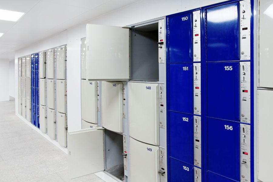 Places to store luggage in Paris: This is an image of all the lockers in a white, sterilised room used for storing luggage and personal items.