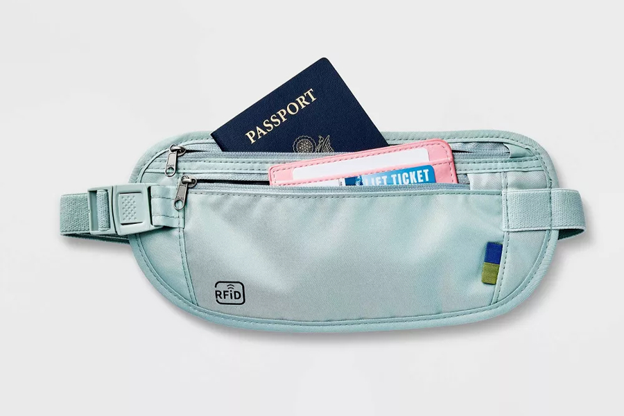 RFID-blocking money belt holding a passport and tickets, one of the discreet anti-theft travel devices for Paris.