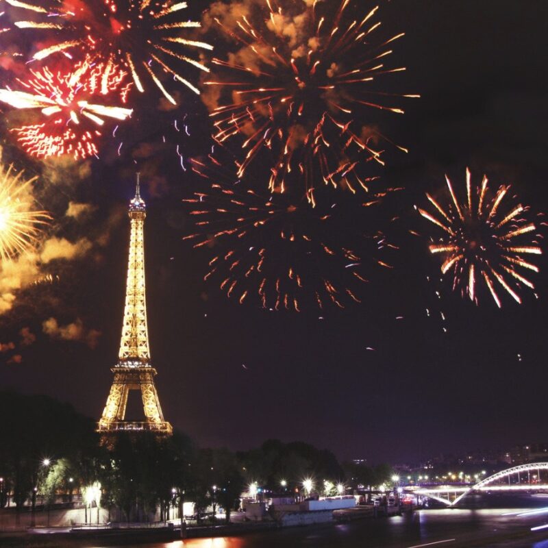 This is an image of big fireworks above the Eiffel Tower.