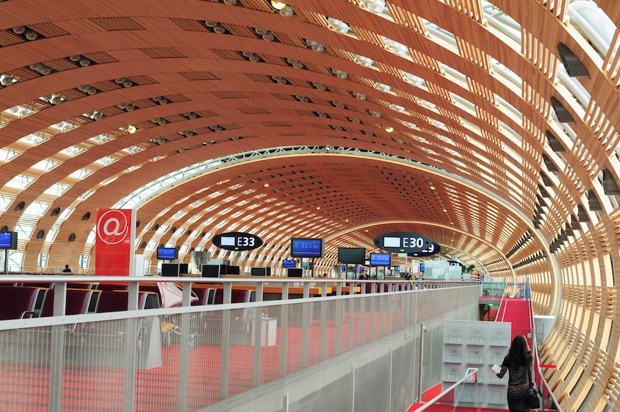 This is an image of the inside of a big airport with a cool, modern design.