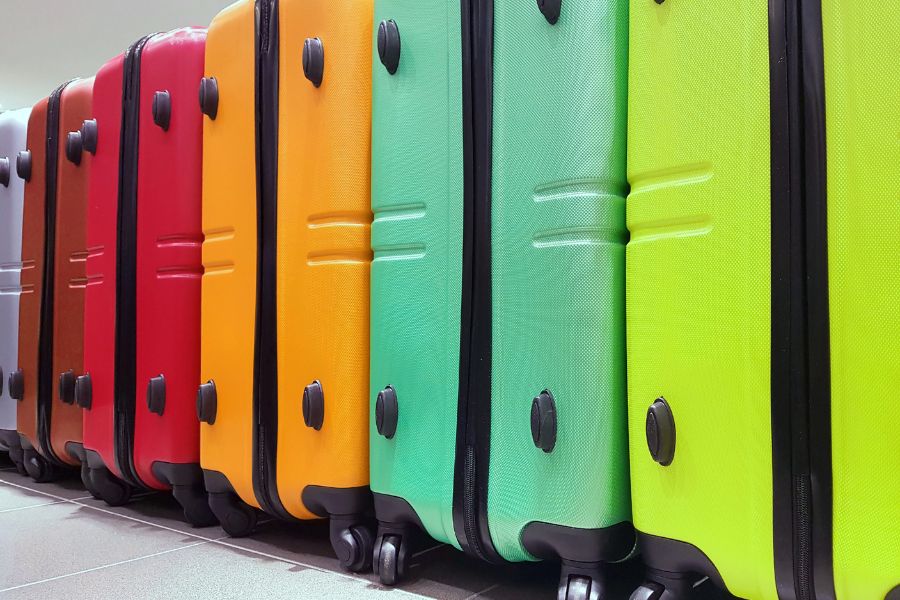 This is an image of a lineup of colourful suitcases.
