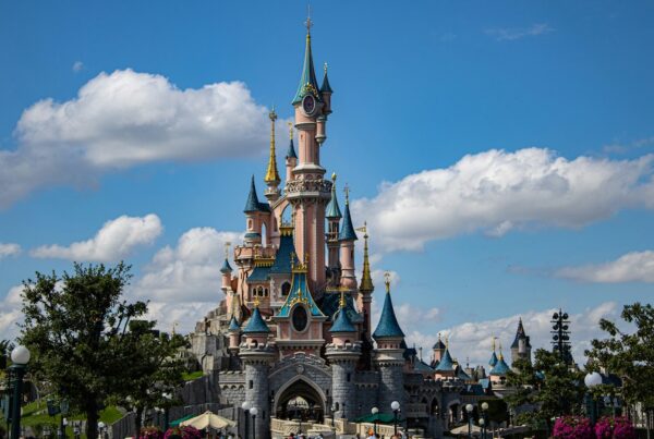 This is an image of the Disney castle with blue skies behind it.