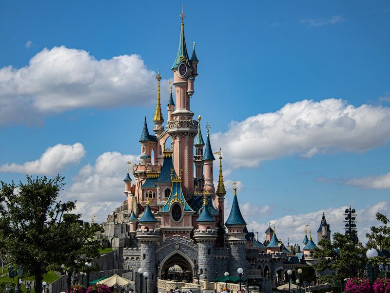 This is an image of the Disney castle with blue skies behind it.