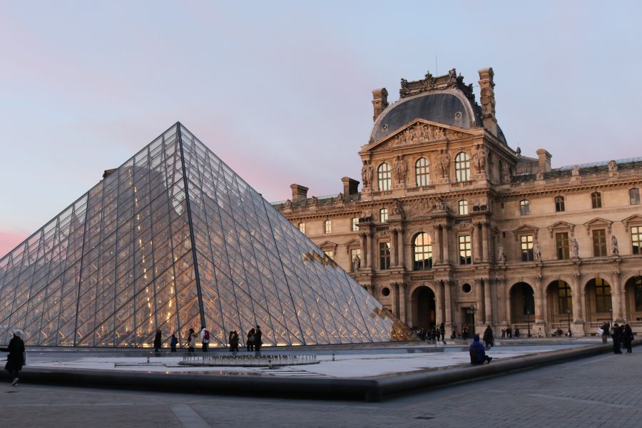 This is a picture of the Louvre with a nice building at the back.