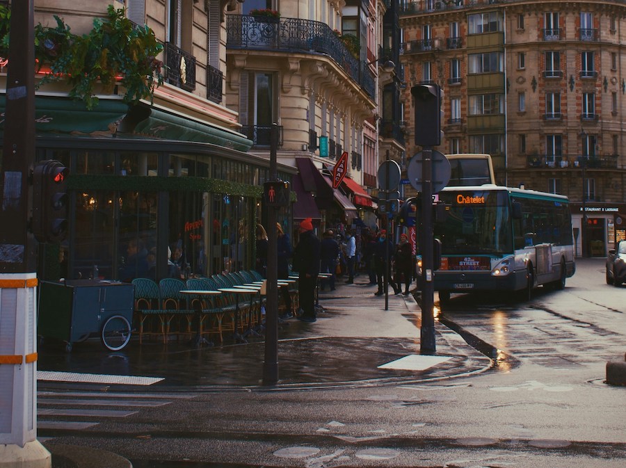 This is a picture of a bus picking up passengers in Paris.