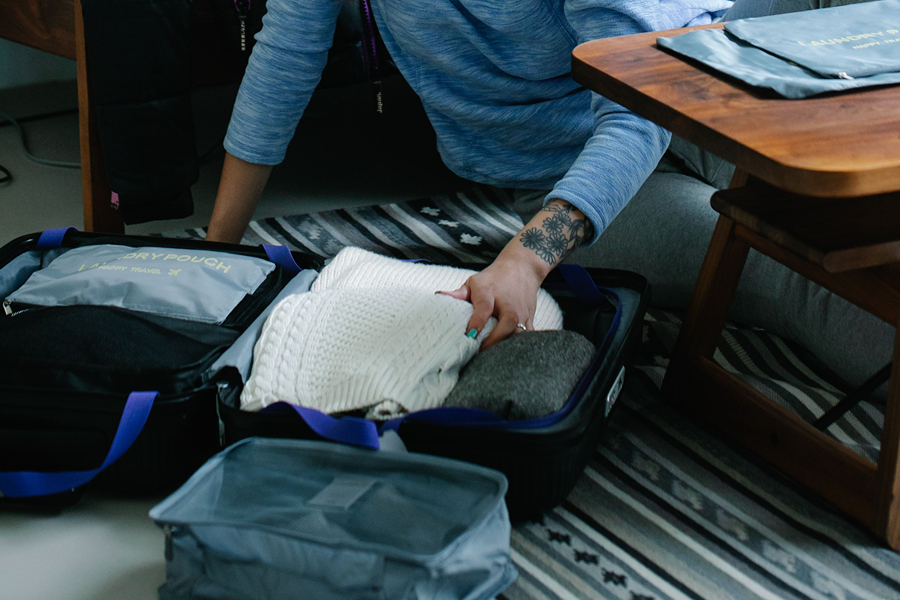 Packing cubes helping organise clothes in a suitcase, one of the most useful Paris travel accessories for staying organised.