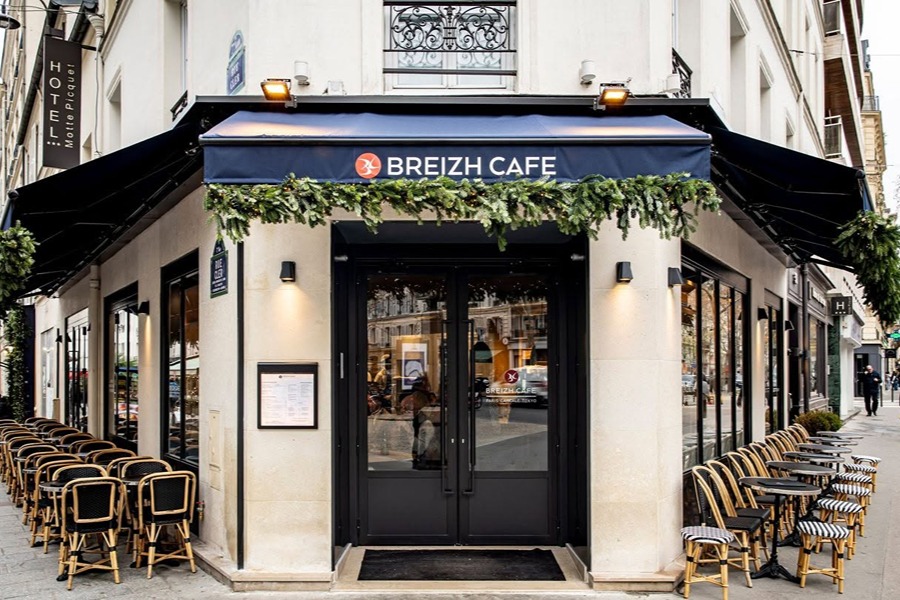 Breizh Café, one of the places to eat with kids in Paris, with outdoor seating and a traditional Parisian café exterior.