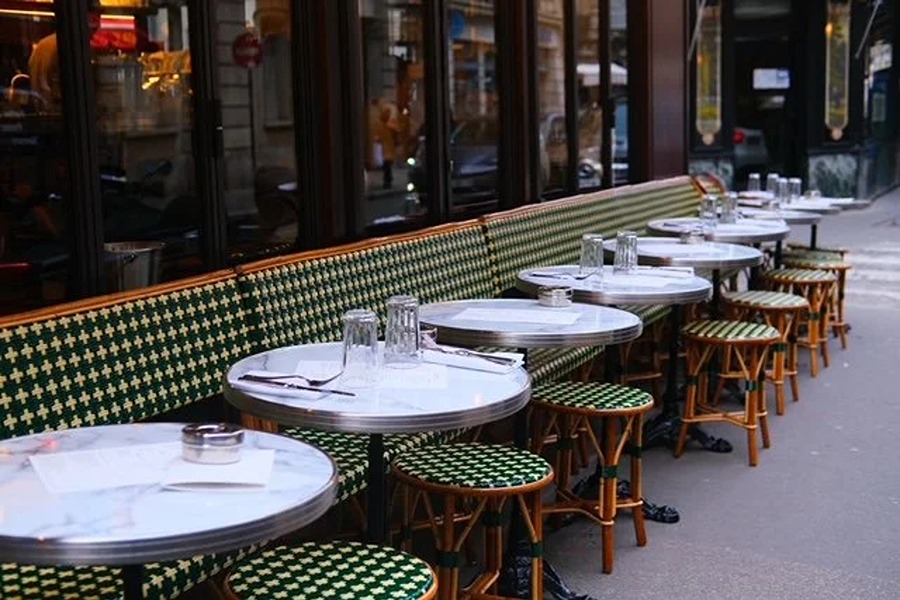 Outdoor seating at Café Caillou, one of the family-friendly places to eat with kids in Paris near the Eiffel Tower.