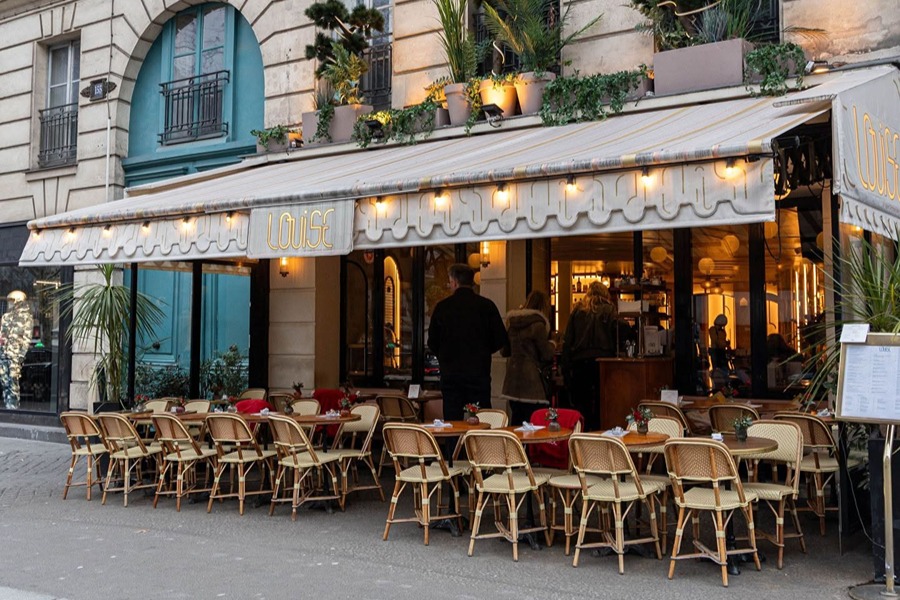 Outdoor terrace at Café Louise, one of the family-friendly places to eat with kids in Paris near the Louvre.