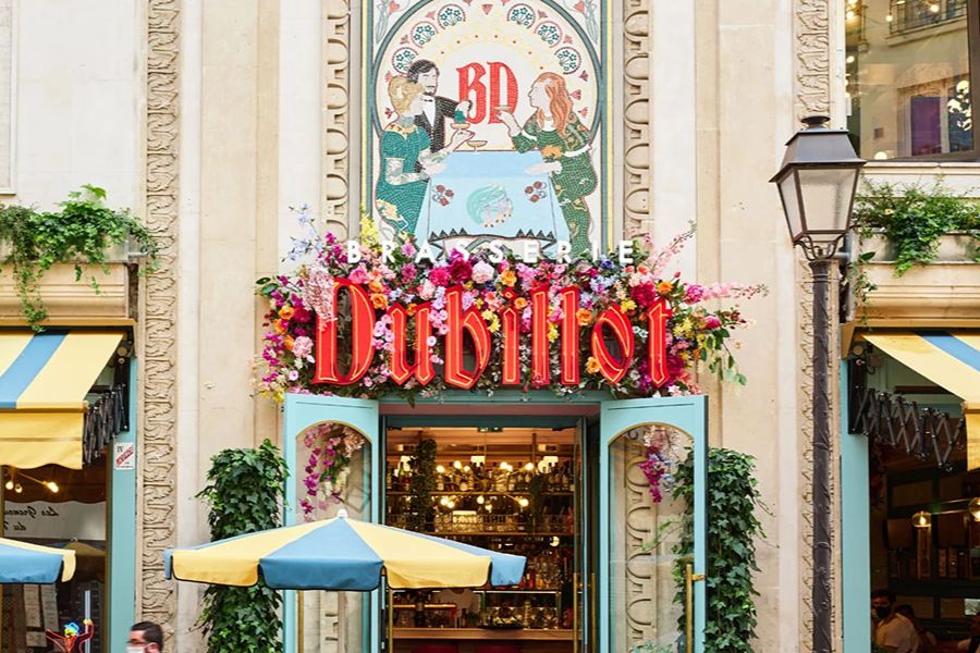 Colourful exterior of Brasserie Dubillot, one of the family-friendly places to eat with kids in Paris.