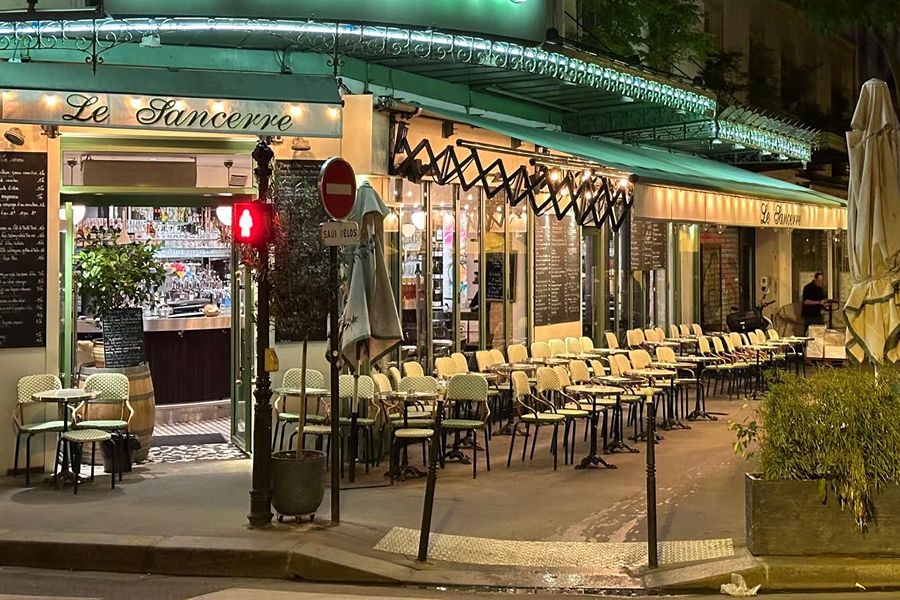 Exterior terrace of Le Sancerre in Le Marais, one of the family-friendly places to eat with kids in Paris.