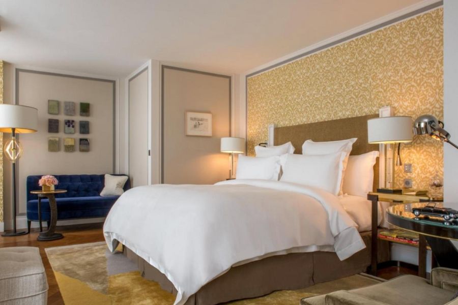 This is an image of a fancy hotel room in Paris with nice mood lighting.