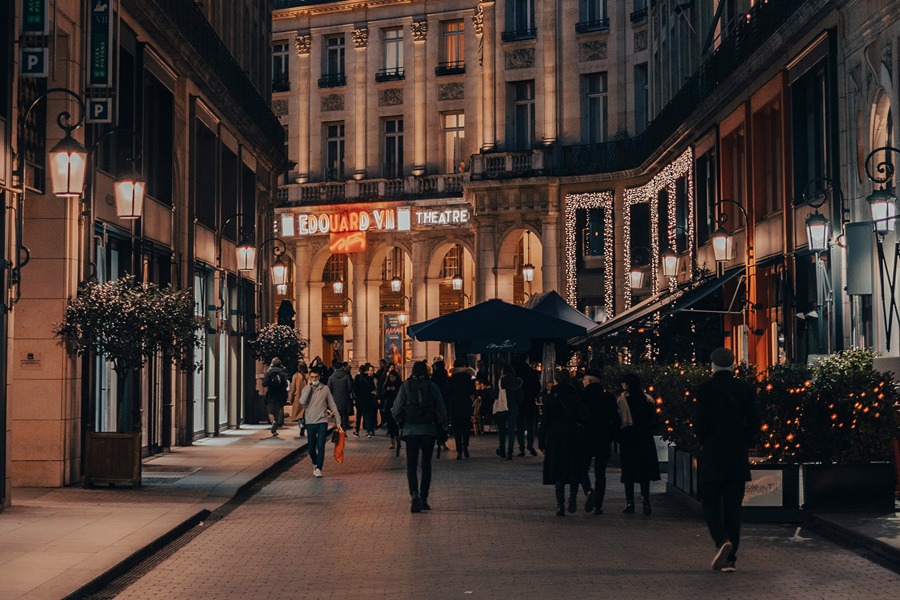 Christmas lights glowing along a Paris boulevard on a November evening