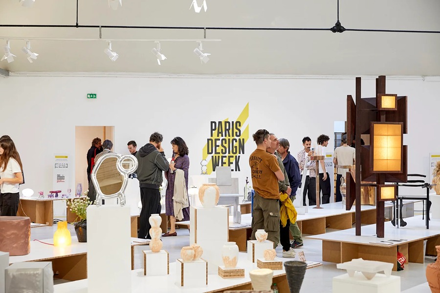 Visitors browsing furniture and ceramics at Paris Design Week, one of the best things to do in September in Paris