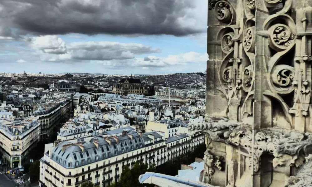 This is an image fo a view of Paris from the top of a Tower in the city. The tower is not as high as other viewpoints, but the scenery is still stunning.