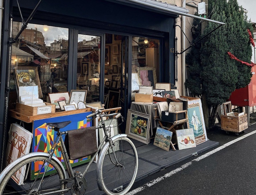 This is an image of bric-a-brac out front of an antique store. Getting a tour of the world's largest flea market is a unique experience to try in Paris.