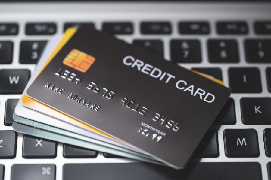 This is an image of a credit card stack on the top of a keyboard.
